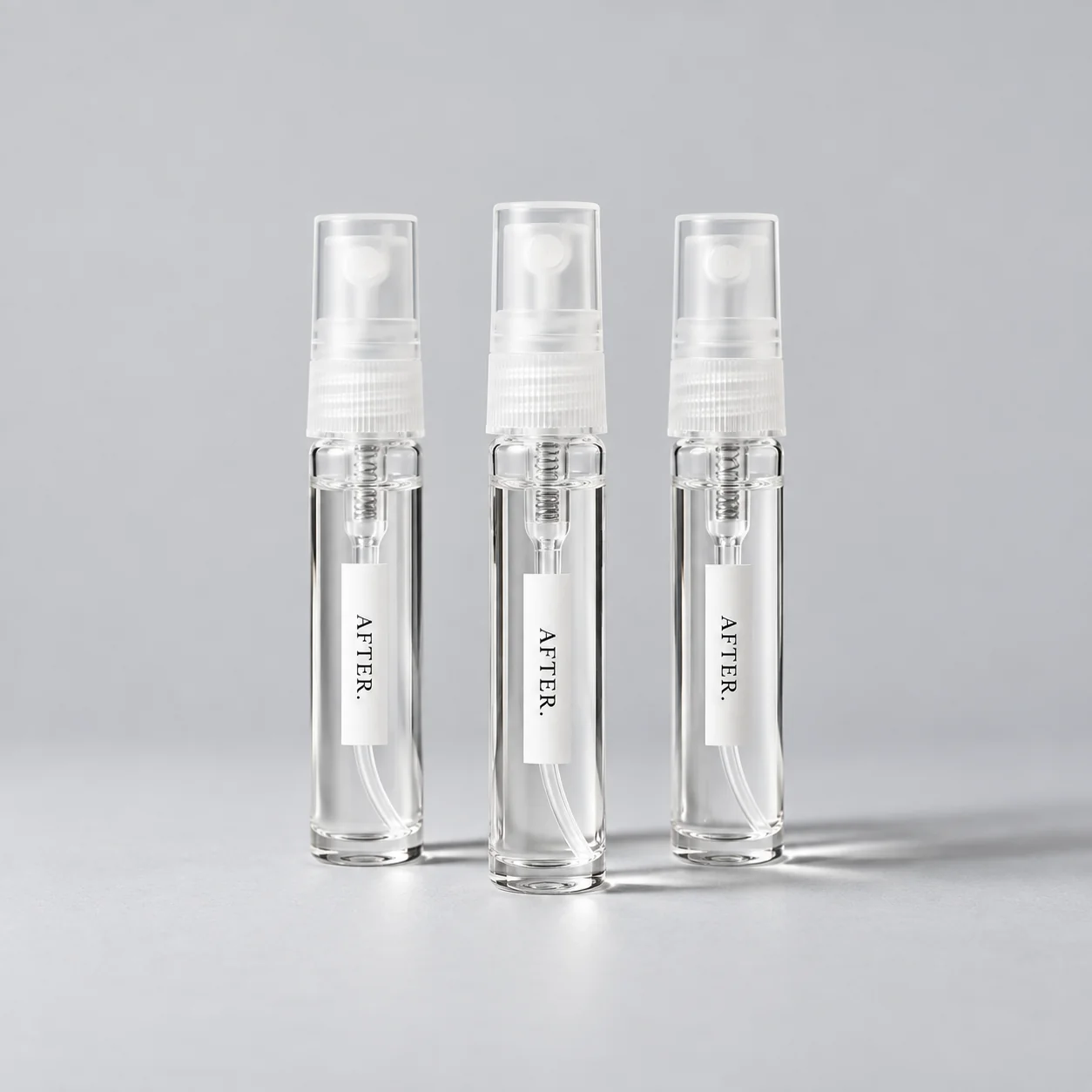 Three slim, clear AFTER. 5 mL spray packaging previews